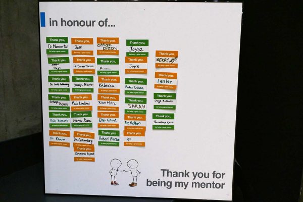 A whiteboard with name tags thanking specific mentors in the New College Mentorship program.
