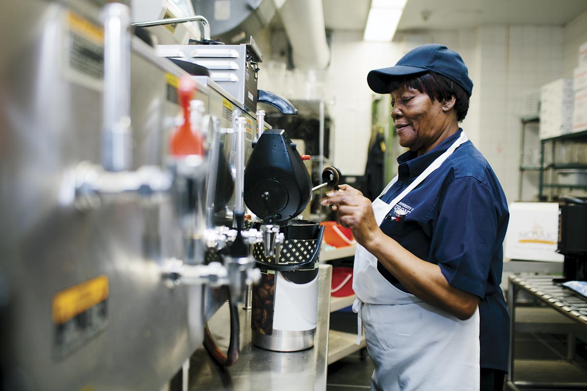 Preparing coffee for on-campus catering—another of the tasks that keeps the New College kitchen busy.